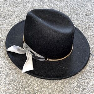 black fedora with ribbon and gold chain